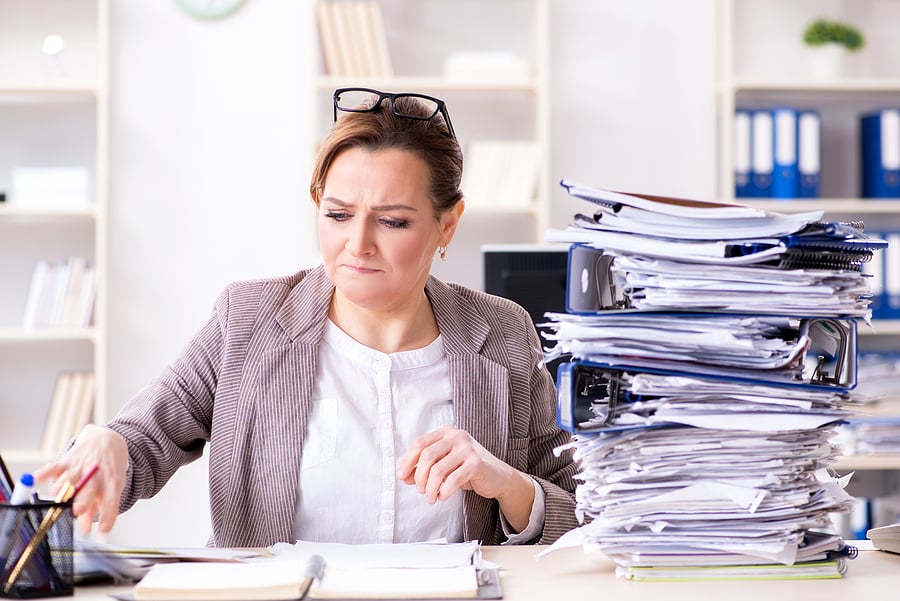 paper-clutter-on-desk