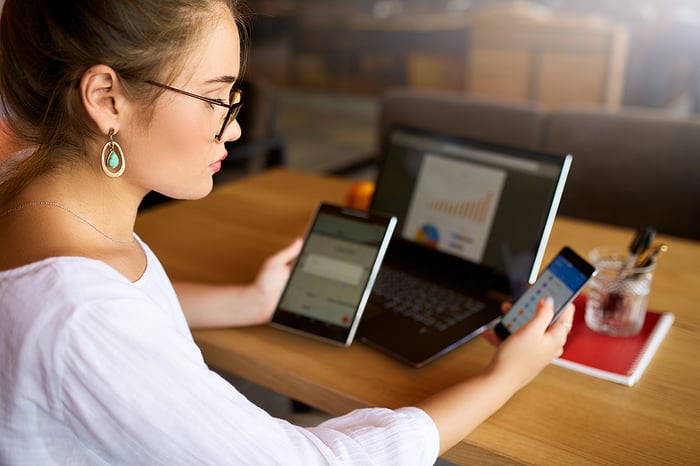 woman-using-multiple-devices